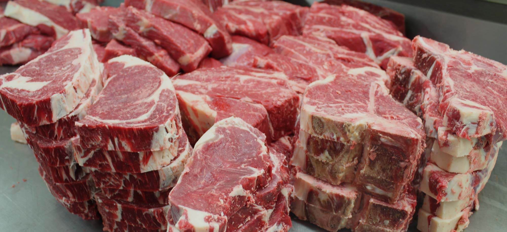 Stacks of custom cut beef steaks